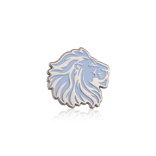 Silver lion head pin on a white background