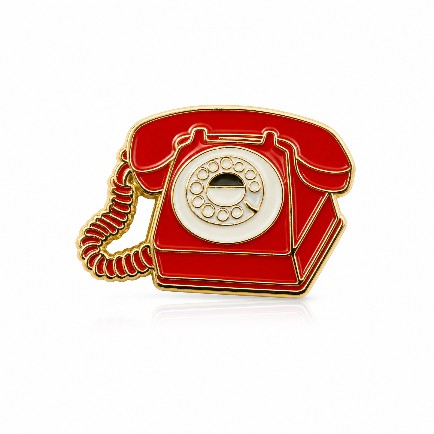 A vintage-style rotary telephone enamel pin in red with gold metal outlines and a cream-colored circular dial, shown on a clean white background.