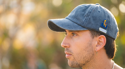 Enamel pins displayed on a denim cap — PinPerfect