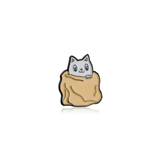 Cat-shaped pin with a beige bag on a white background