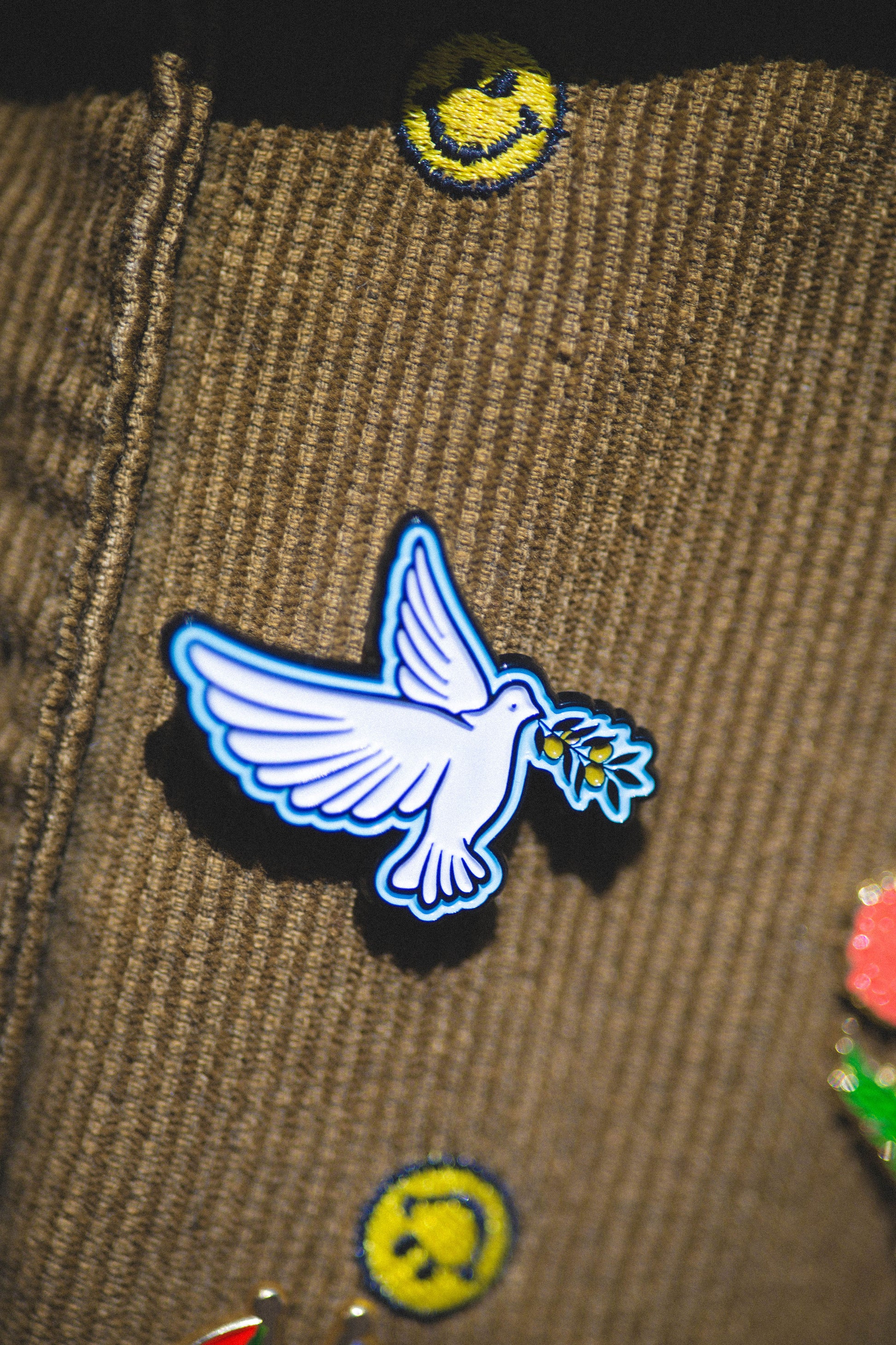 dove pin on bag