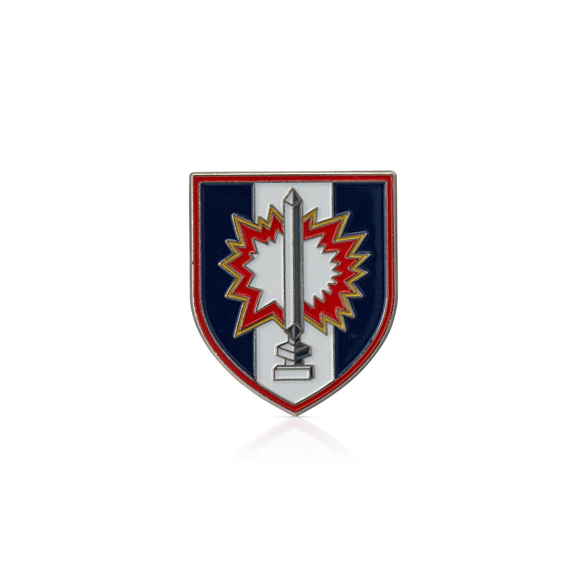 Shield-shaped emblem with a central design on a white background