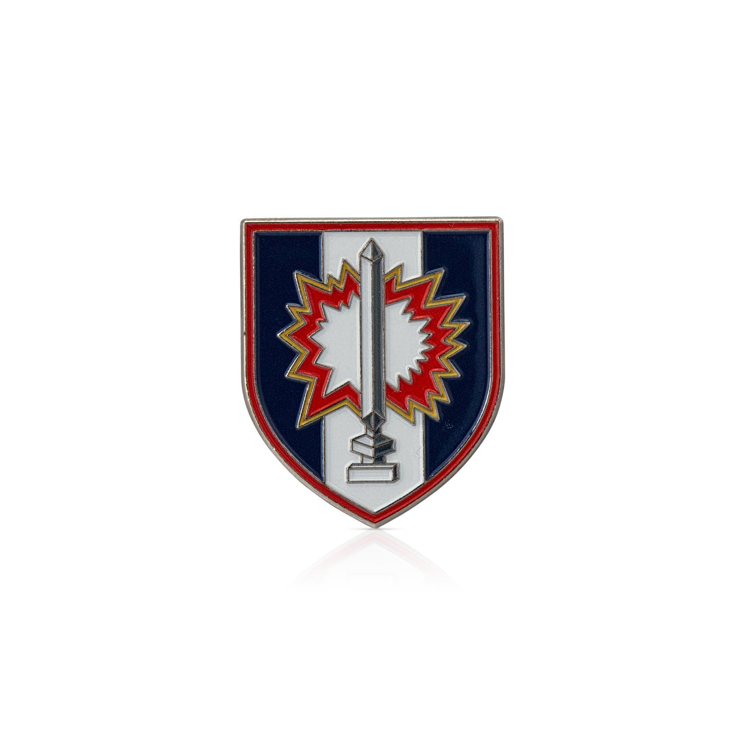 Shield-shaped emblem with a central design on a white background