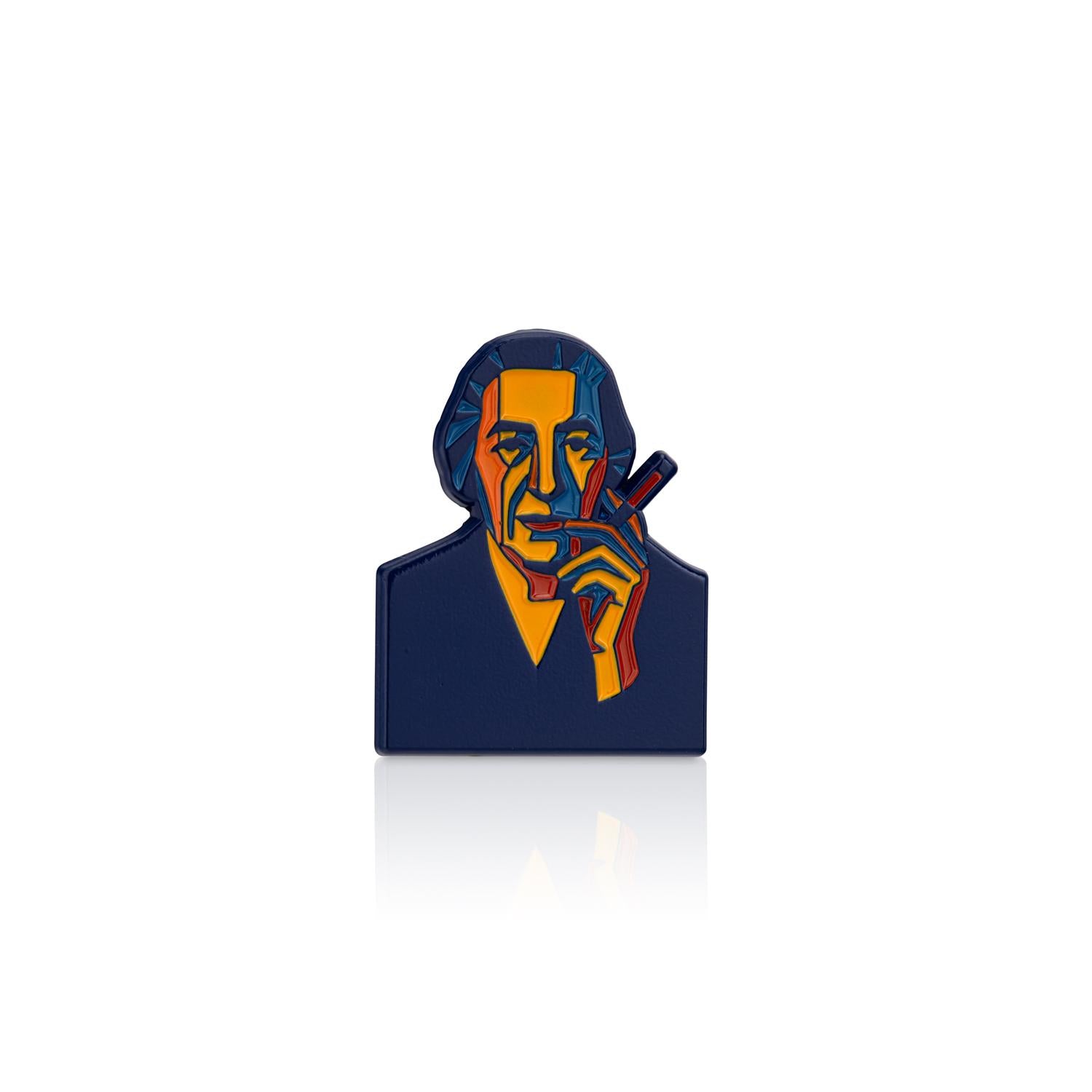 Colorful brooch with a stylized portrait on a white background