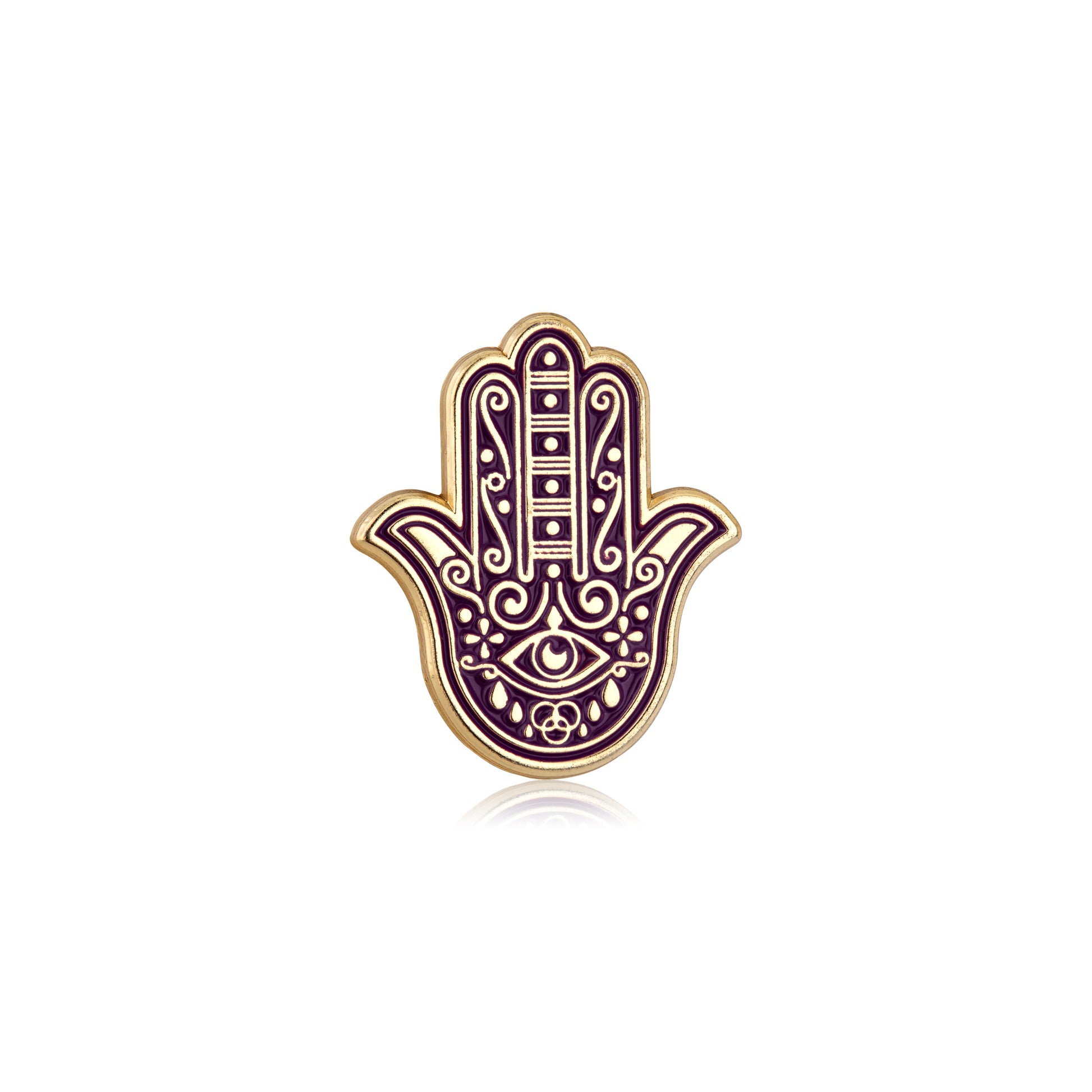 Decorative Hamsa hand pin with intricate designs on a white background