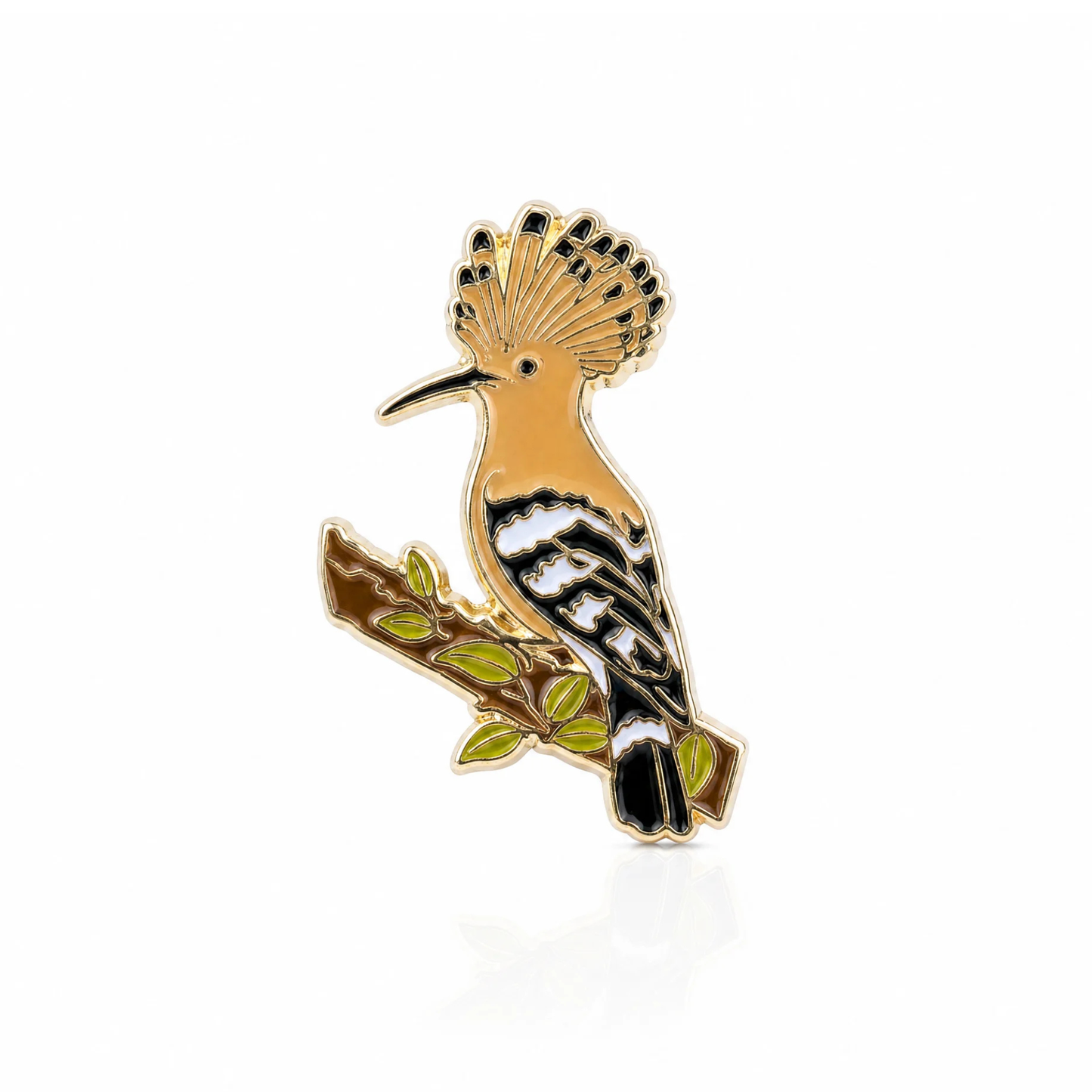 Bird-shaped pin with gold, black, and green colors on a white background