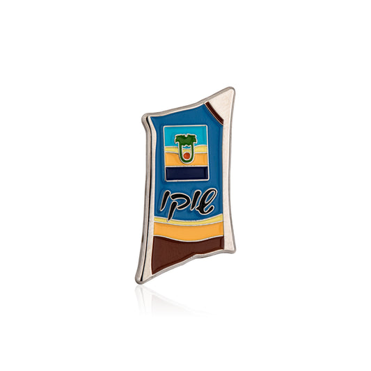 Colorful enamel pin of chocolate milk with a logo and text on a white background
