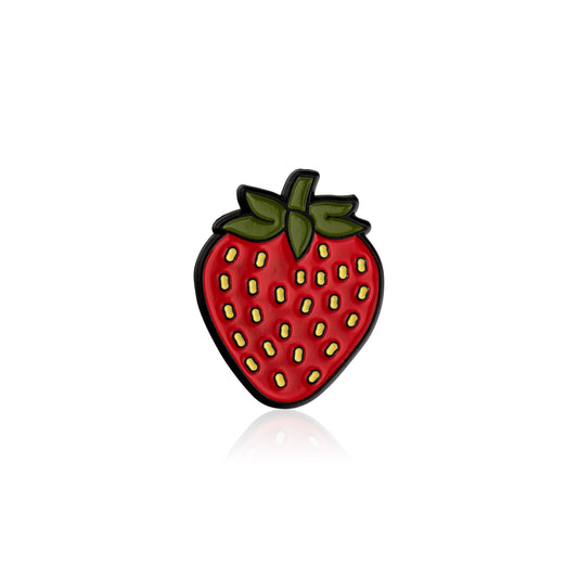 Strawberry-shaped pin on a white background