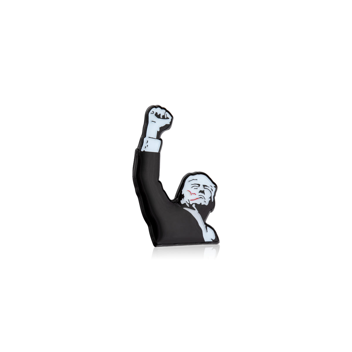 Figurine of Trump with a raised fist on a white background